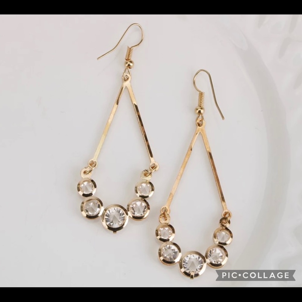 Gold colored drop earrings with crystals